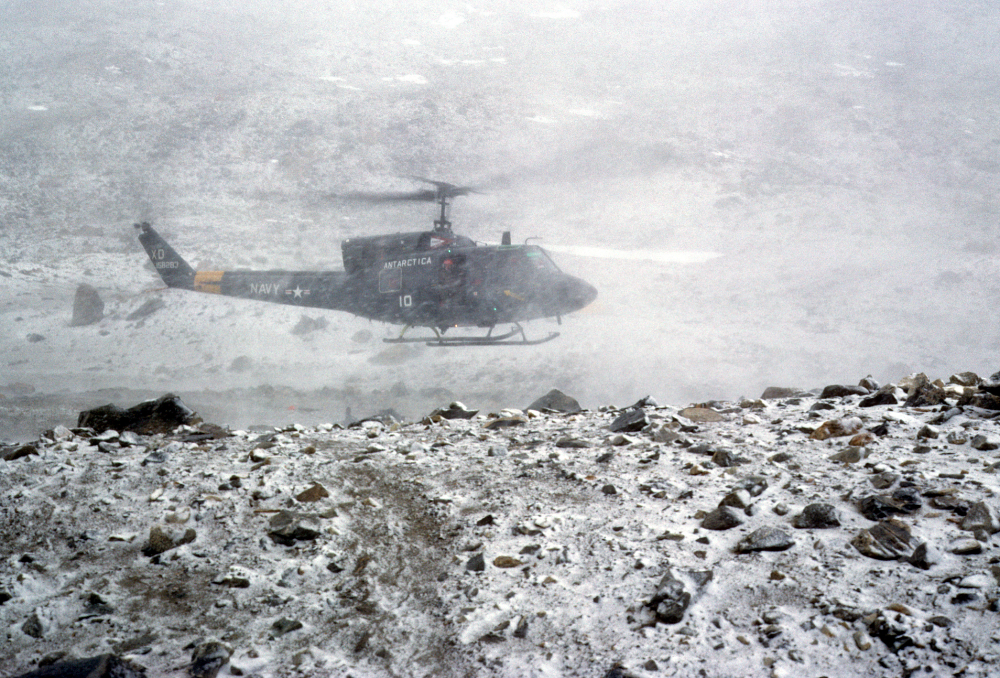 Helo stirring up new snow at camp